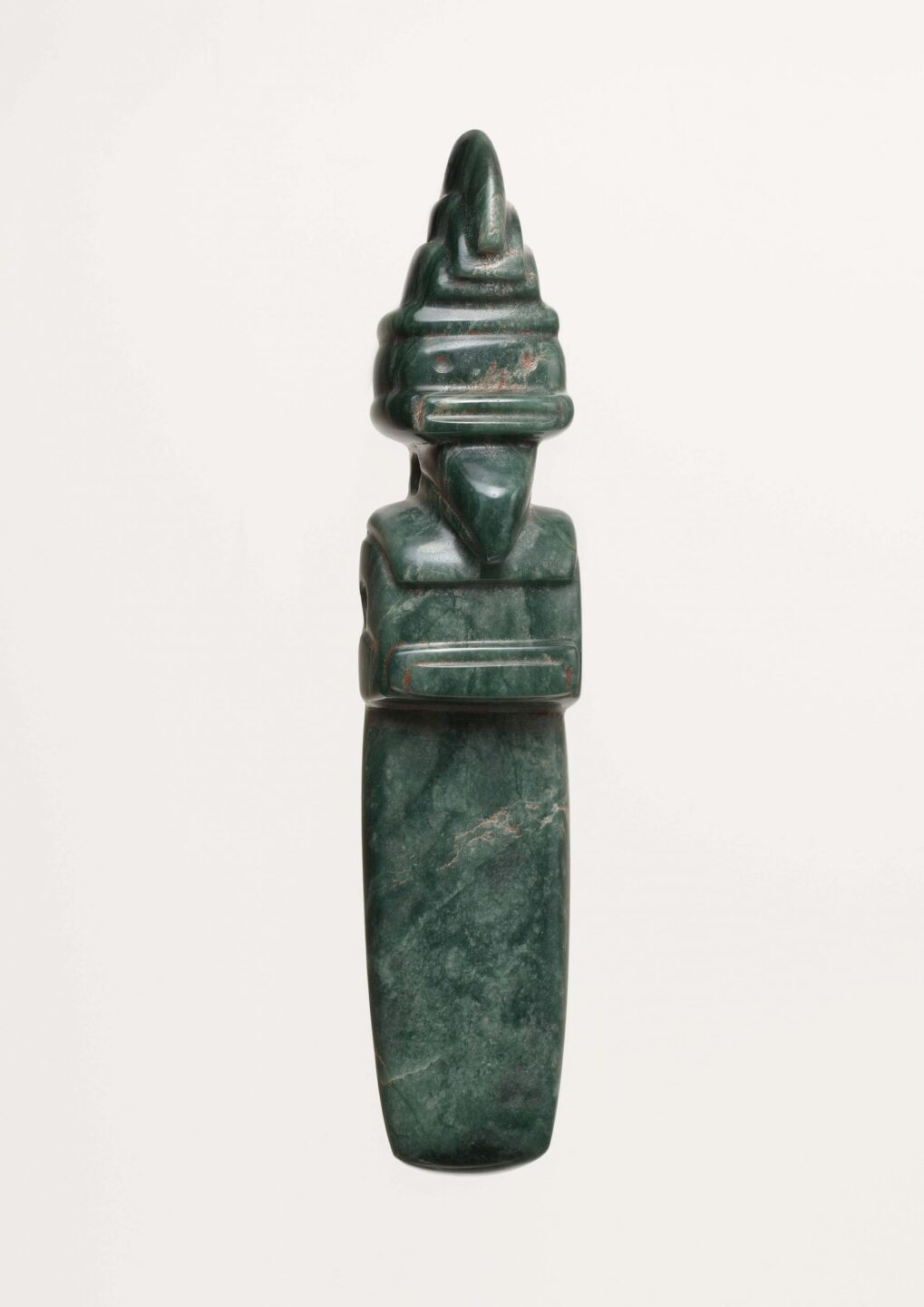 Dark green stone sculpture of a Costa Rican bird wearing a crown.