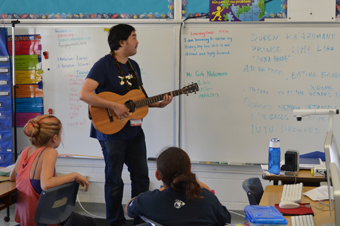 Goh Nakamura plays guitar for the students at Kainalu Elementary School.