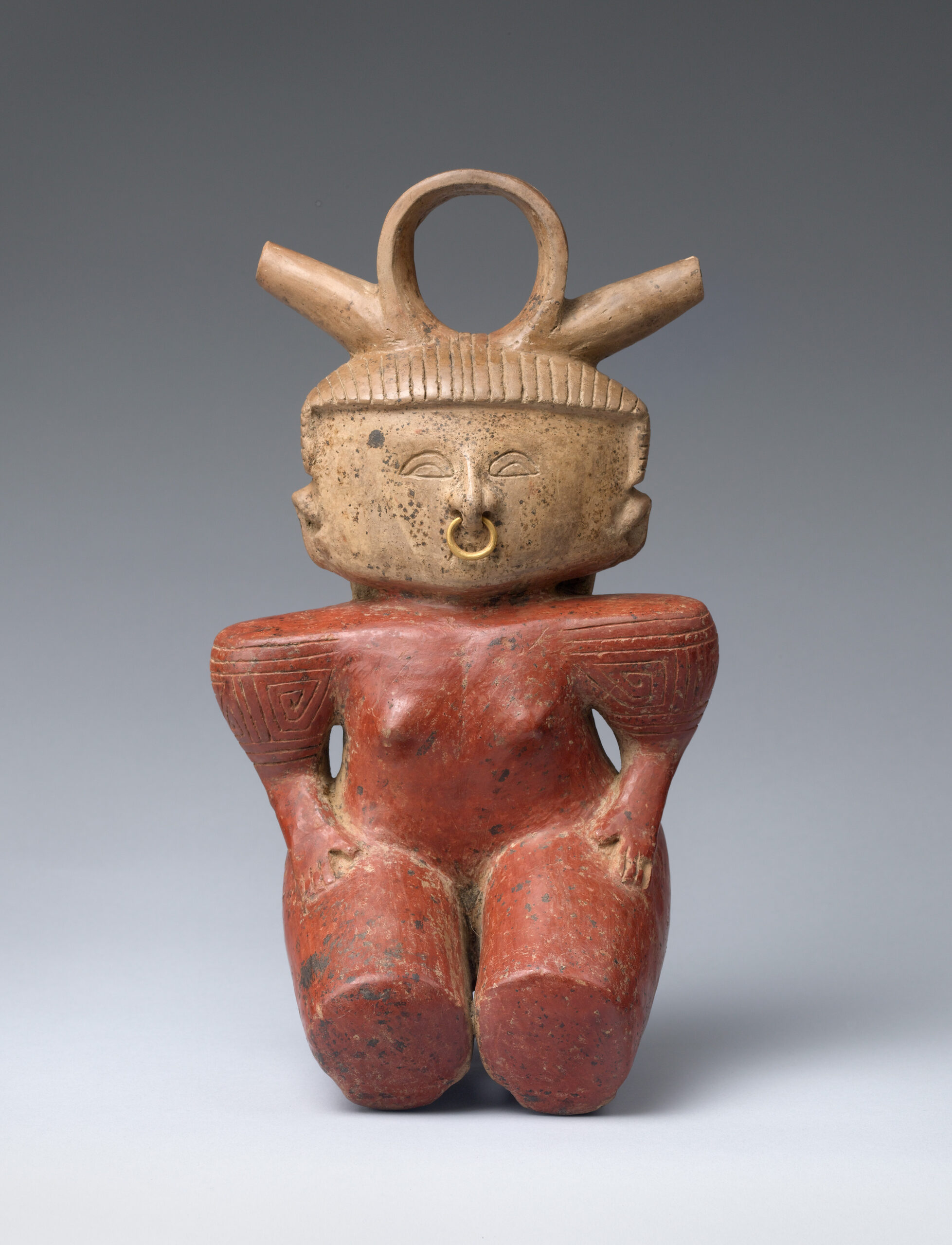 Kneeling woman with a red body and squared shoulders, flat squared face, nose-ring and abstract headpiece.