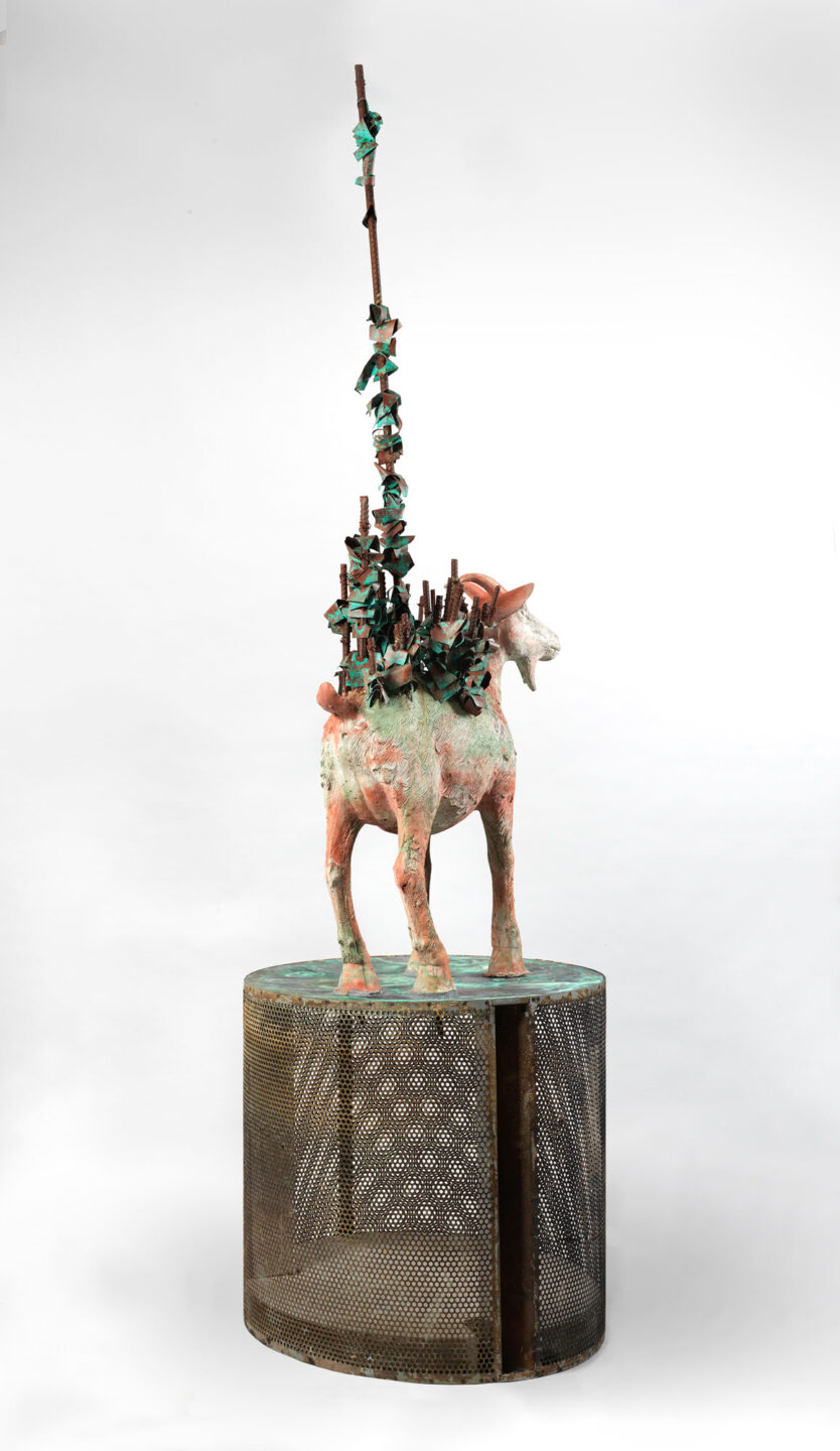 Ribbons of copper and rebar extend from this goat sculpture's back.