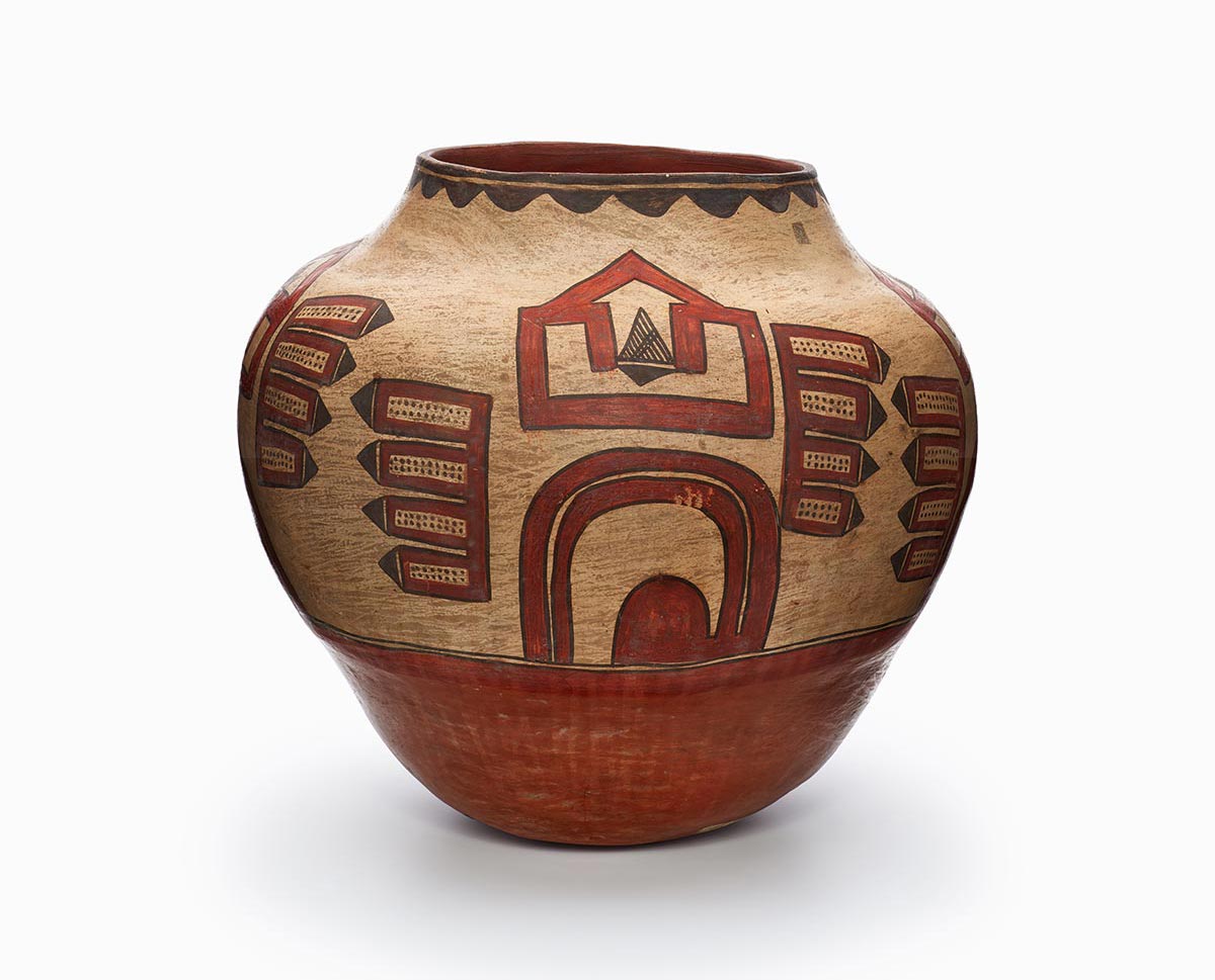 A three-color Zia or Santa Ana polychrome storage jar features white slip with black and red painted decoration.