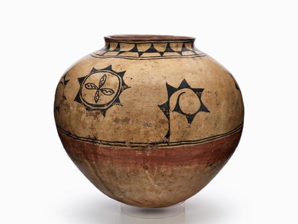 A Cochiti storage jar decorated with geometric and plant designs.