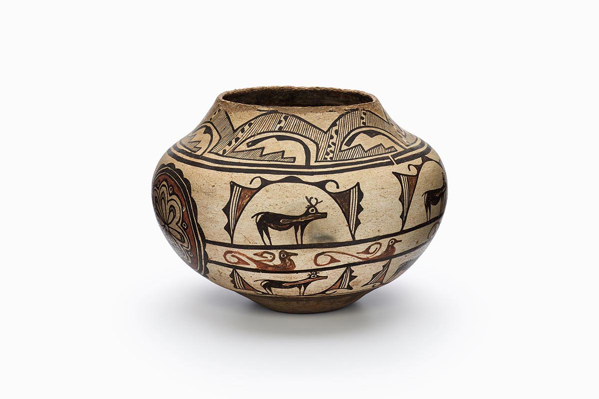 A Zuni jar with designs of animals.