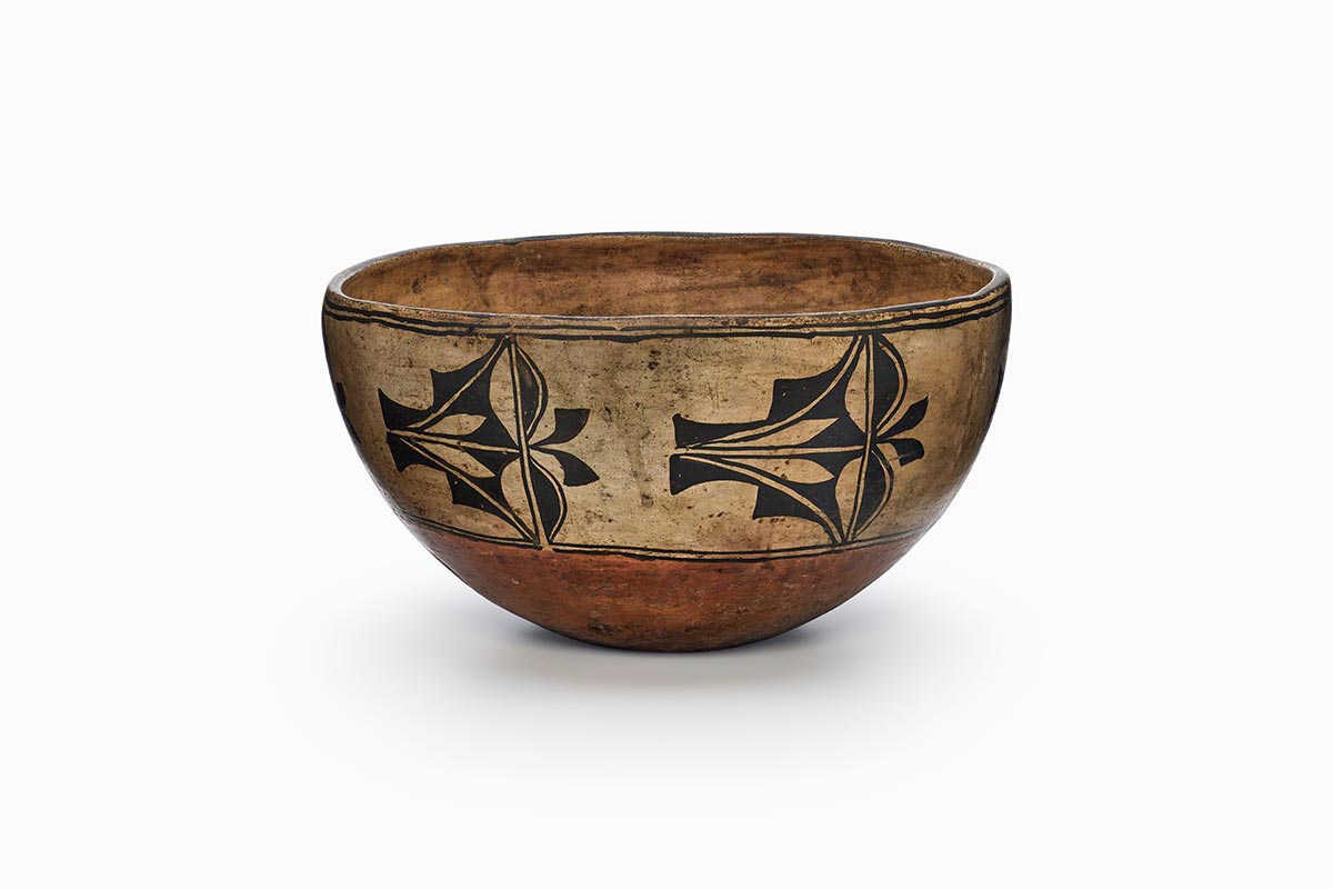 A Cochiti dough bowl with motifs of rain and clouds.