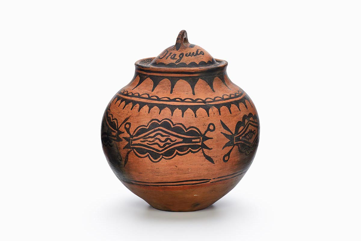 A red and black San Ildefonso jar with lid.