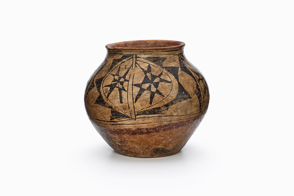 A Santa Ana jar with prominent eight-point star-like motifs.