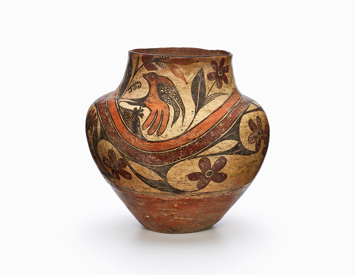 A water jar featuring an Acoma parrot in red and black designs.