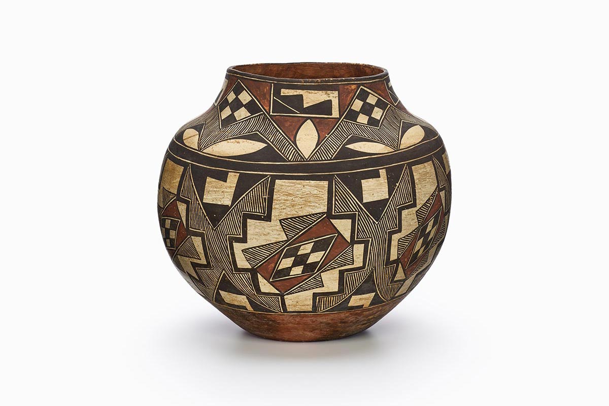 An Acoma jar with two bands of checkered, linear, and geometric patterns in black, beige, and rust-brown pigments.