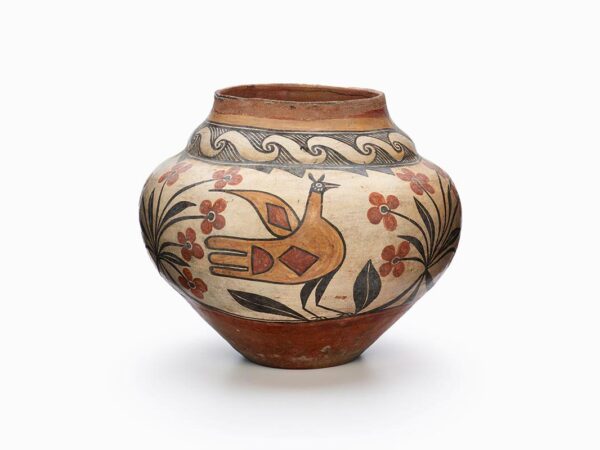 A Zia pot with a large bird and flowers painted in brown, red, and black.