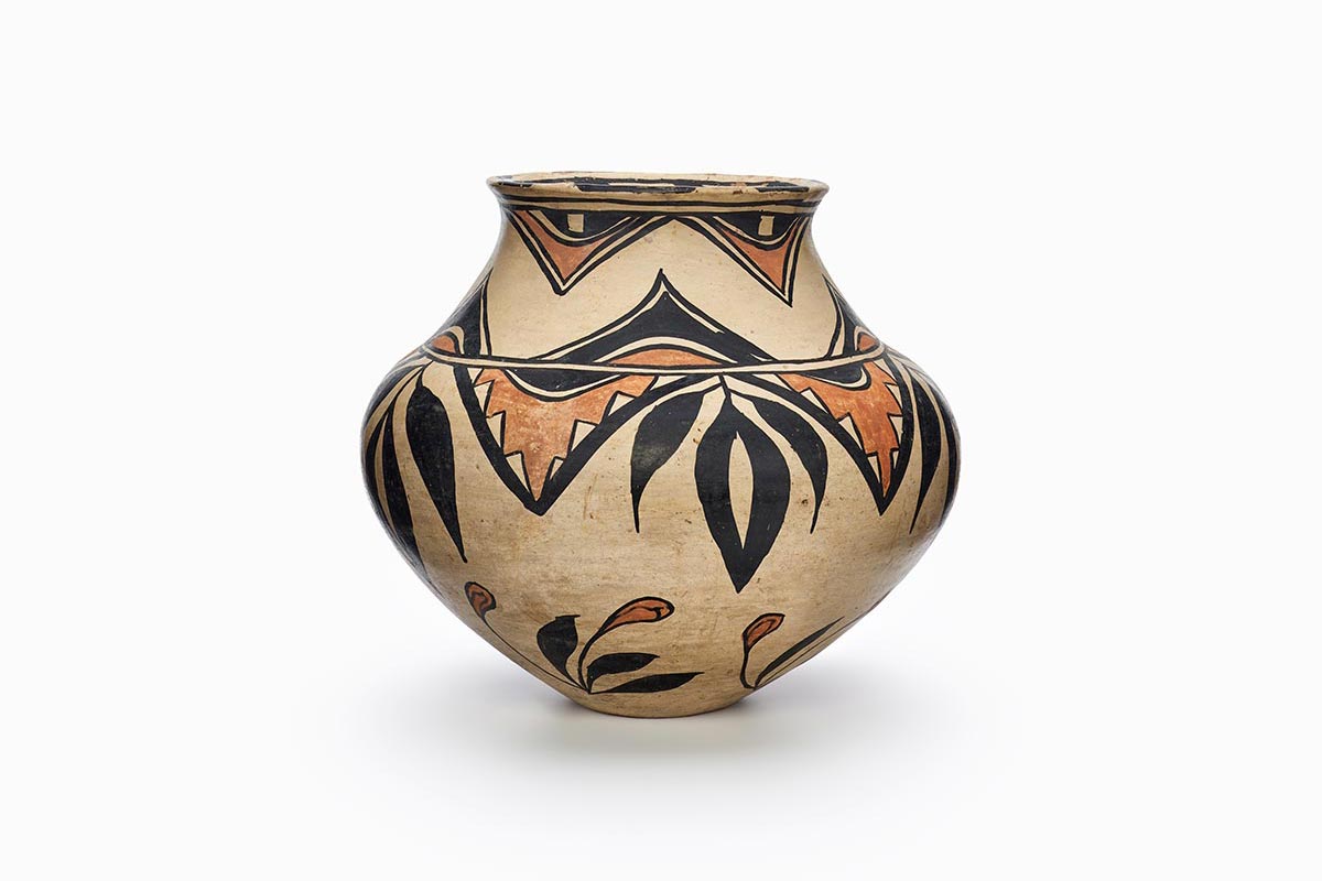 A three-color San Ildefonso polychrome pot with black and red painted decoration.
