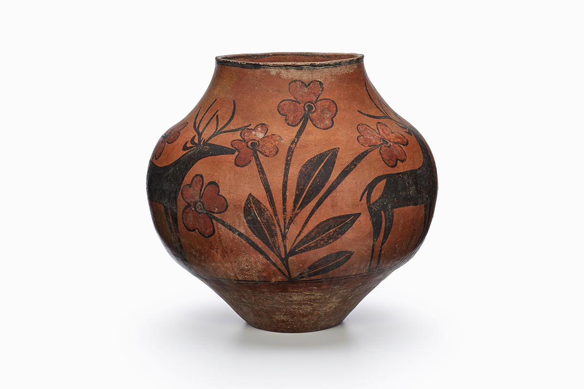 A Zia water jar with a black deer and fire clouds.