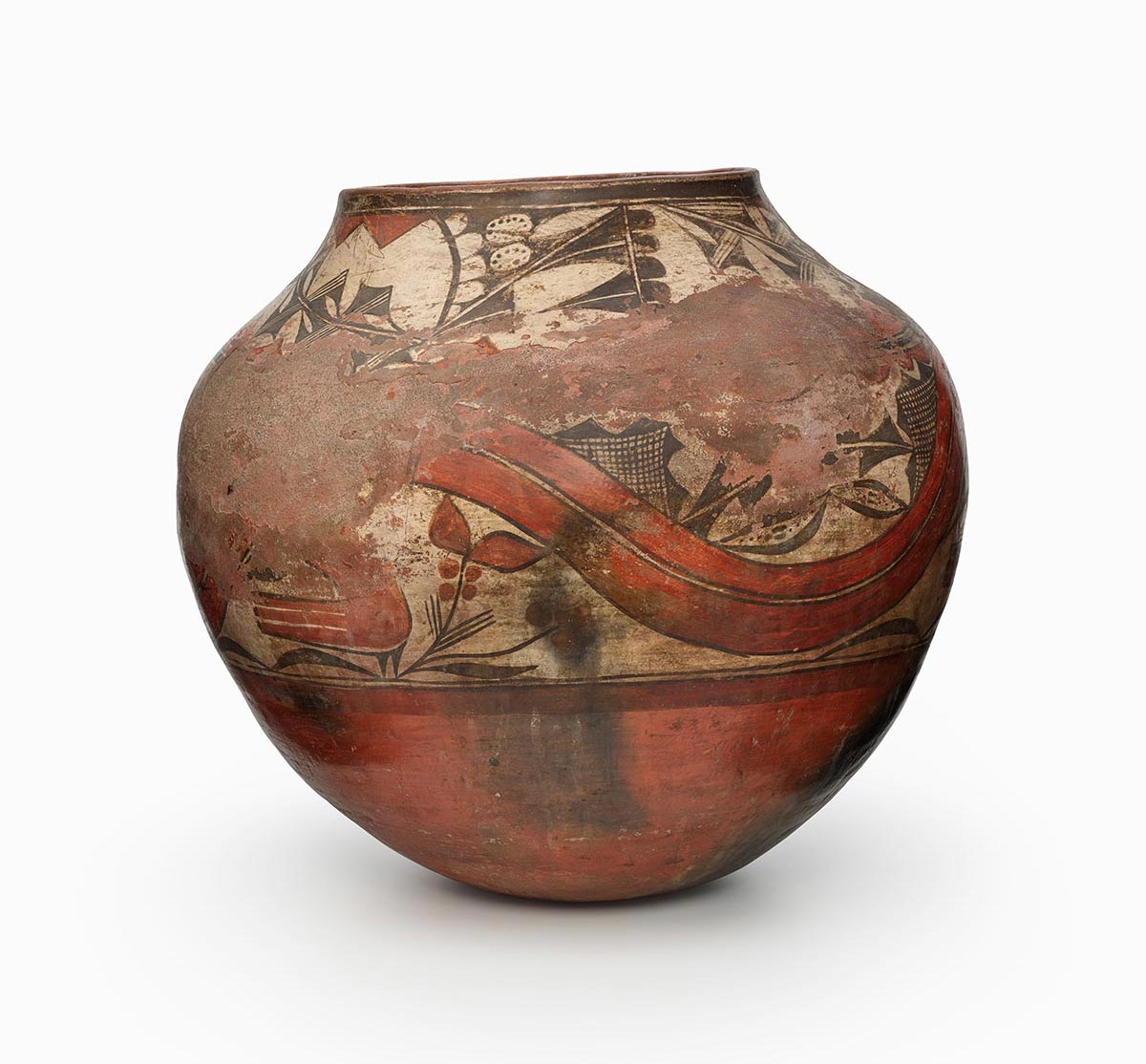 A three-color Zia storage jar features white slip with black and red painted decoration.