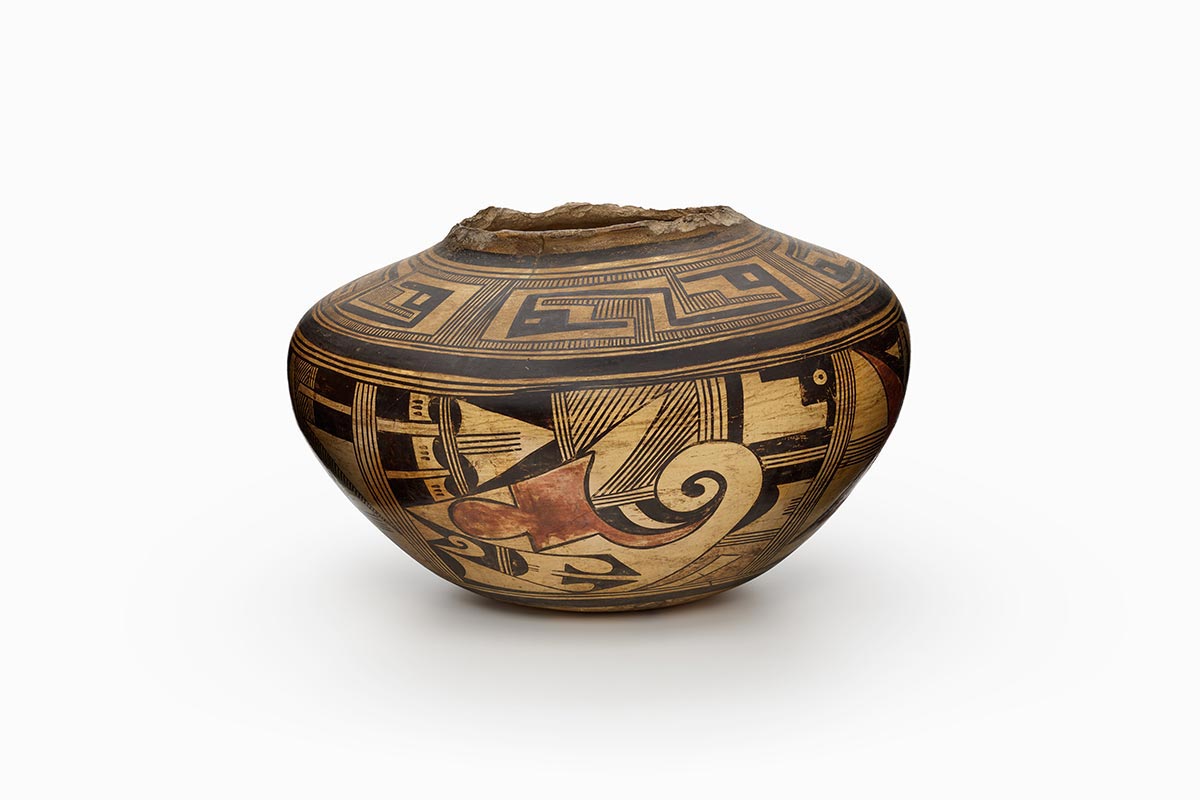 Tewa/Hopi Hano jar with geometric swirls and shapes.