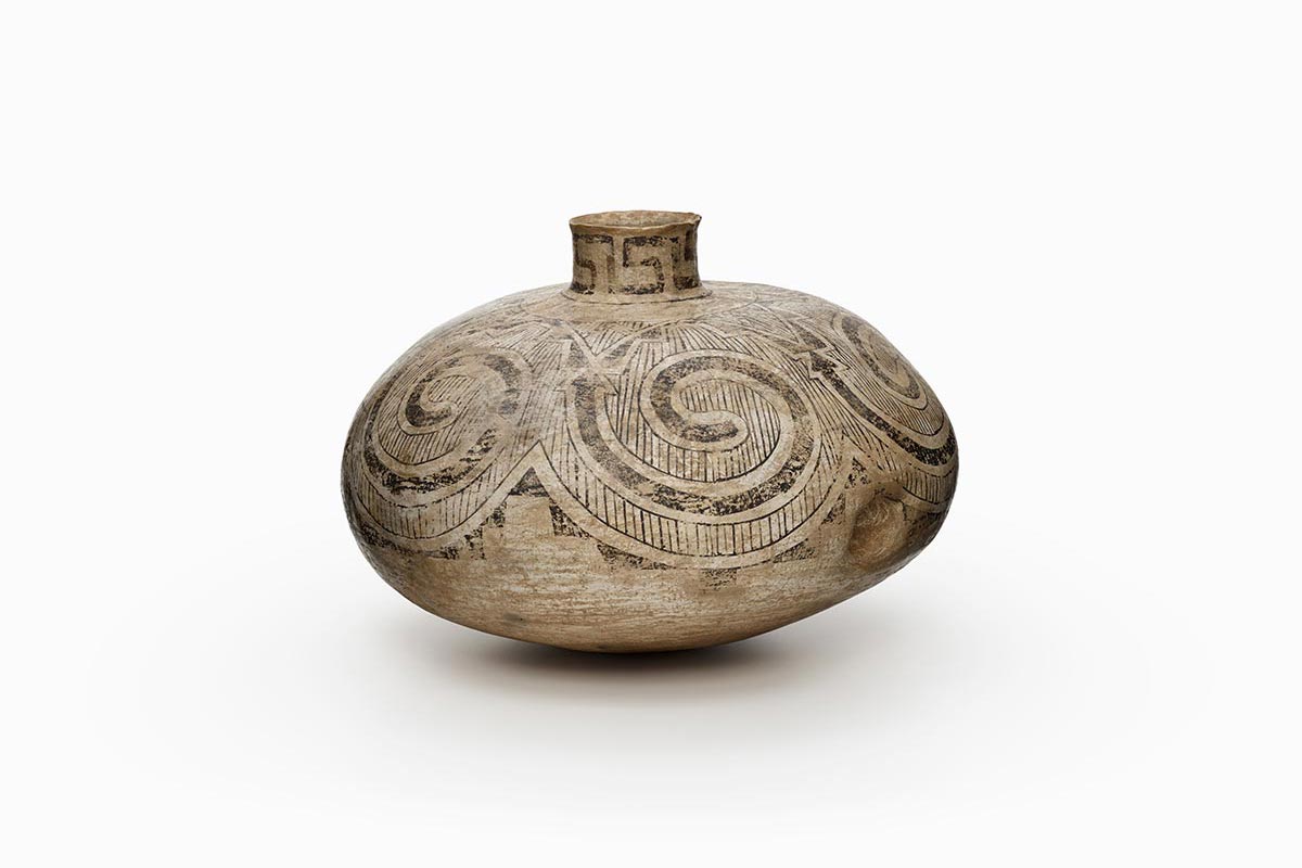 Large white vessel decorated with gray geometric patterns with indentations for holding.